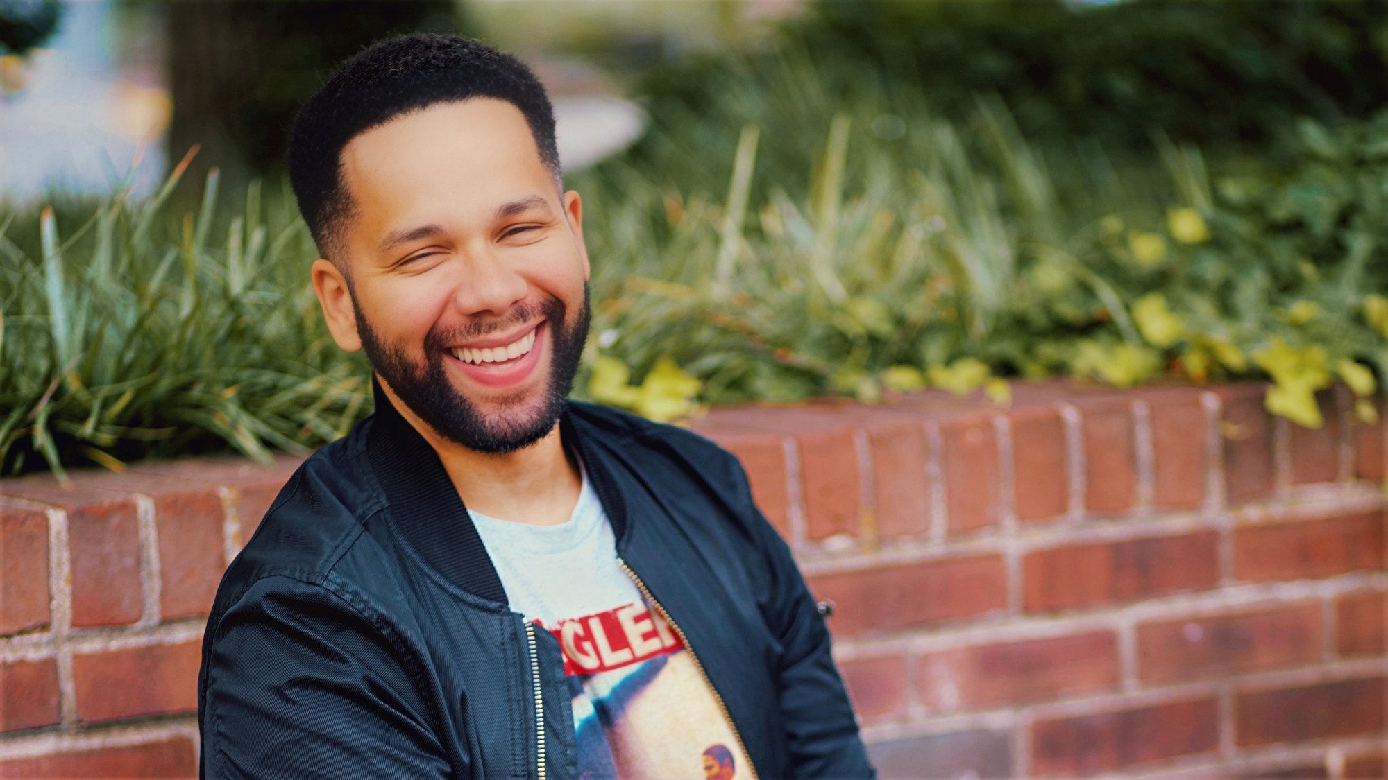 Vladimir Caamaño laughing outdoors